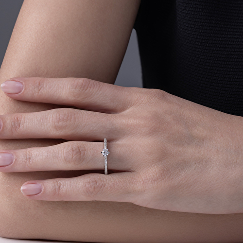 Chris standing up holding his daughter Elva