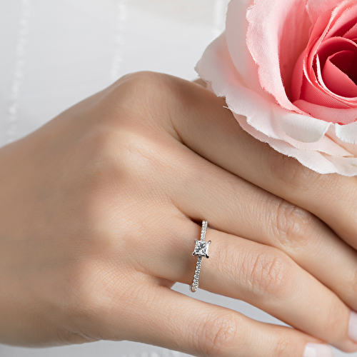 Chris standing up holding his daughter Elva